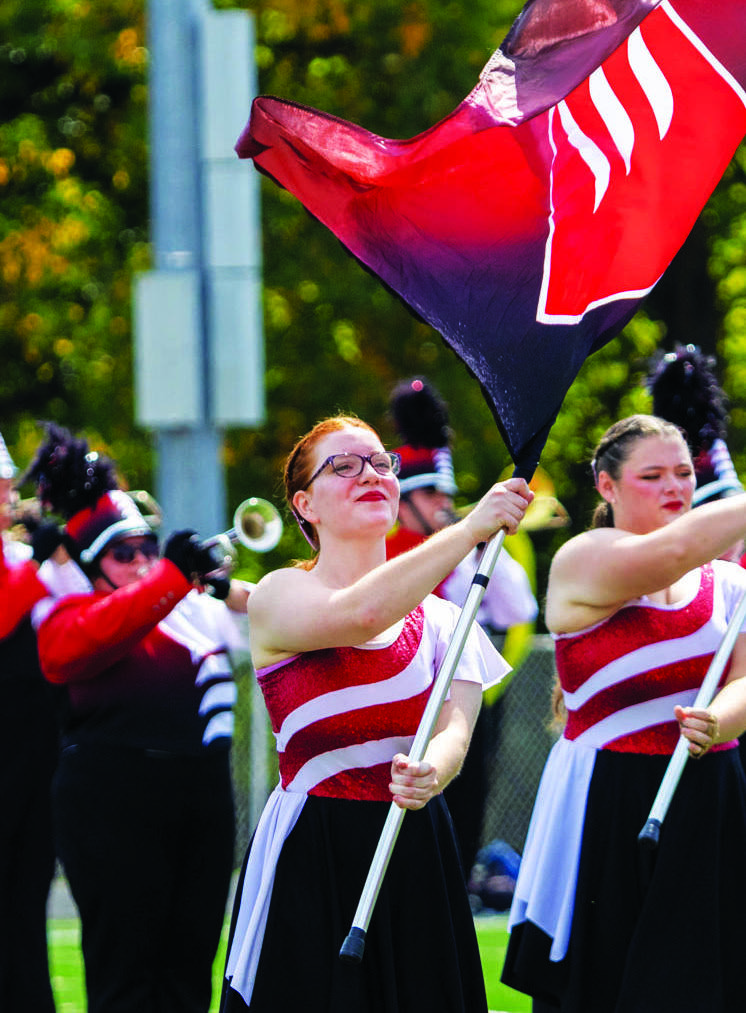 Sophomore Rebecca West twirls a flag for GCC Frontline.
