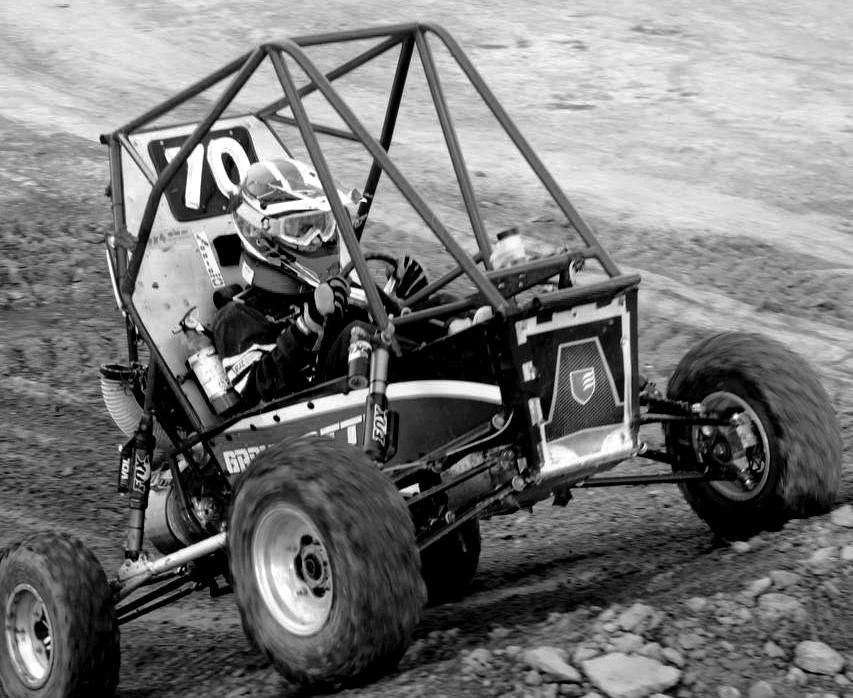 Grove City Racing’s car in action as it climbs up a steep hill.