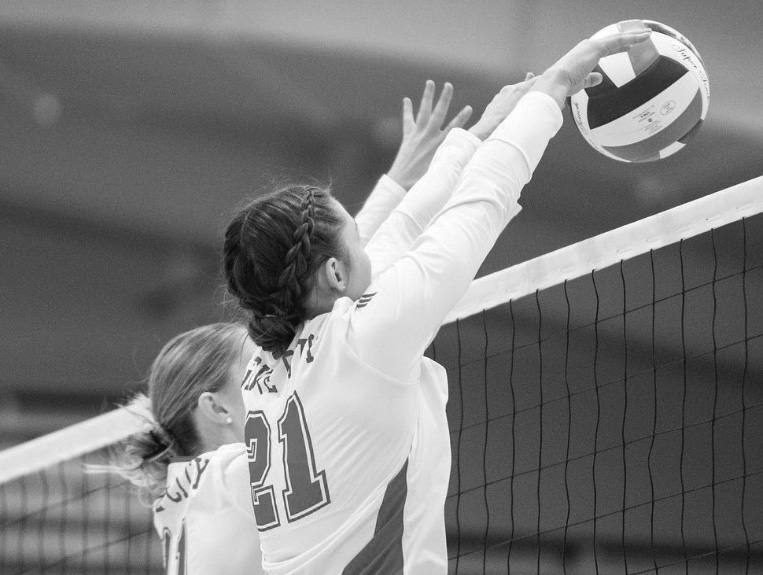 Senior Lila Stonehouse blocks hitting attempt by Chatham.