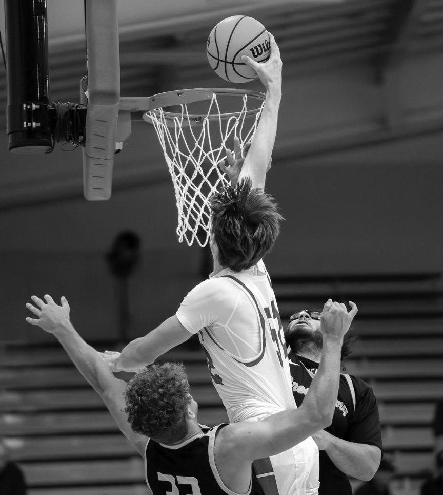 Junior Austin Jancour attempts a contested dunk.