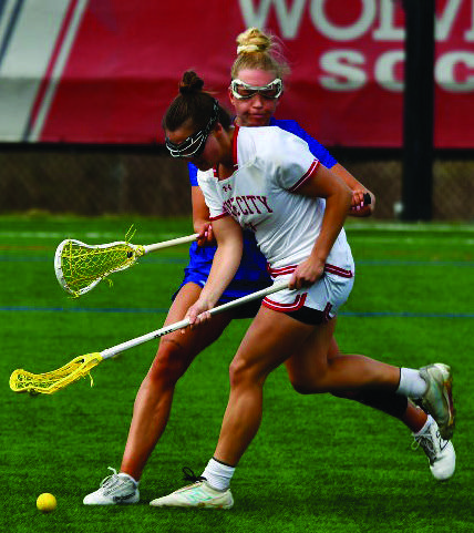 Senior Reese Hasley chasing a ground ball.