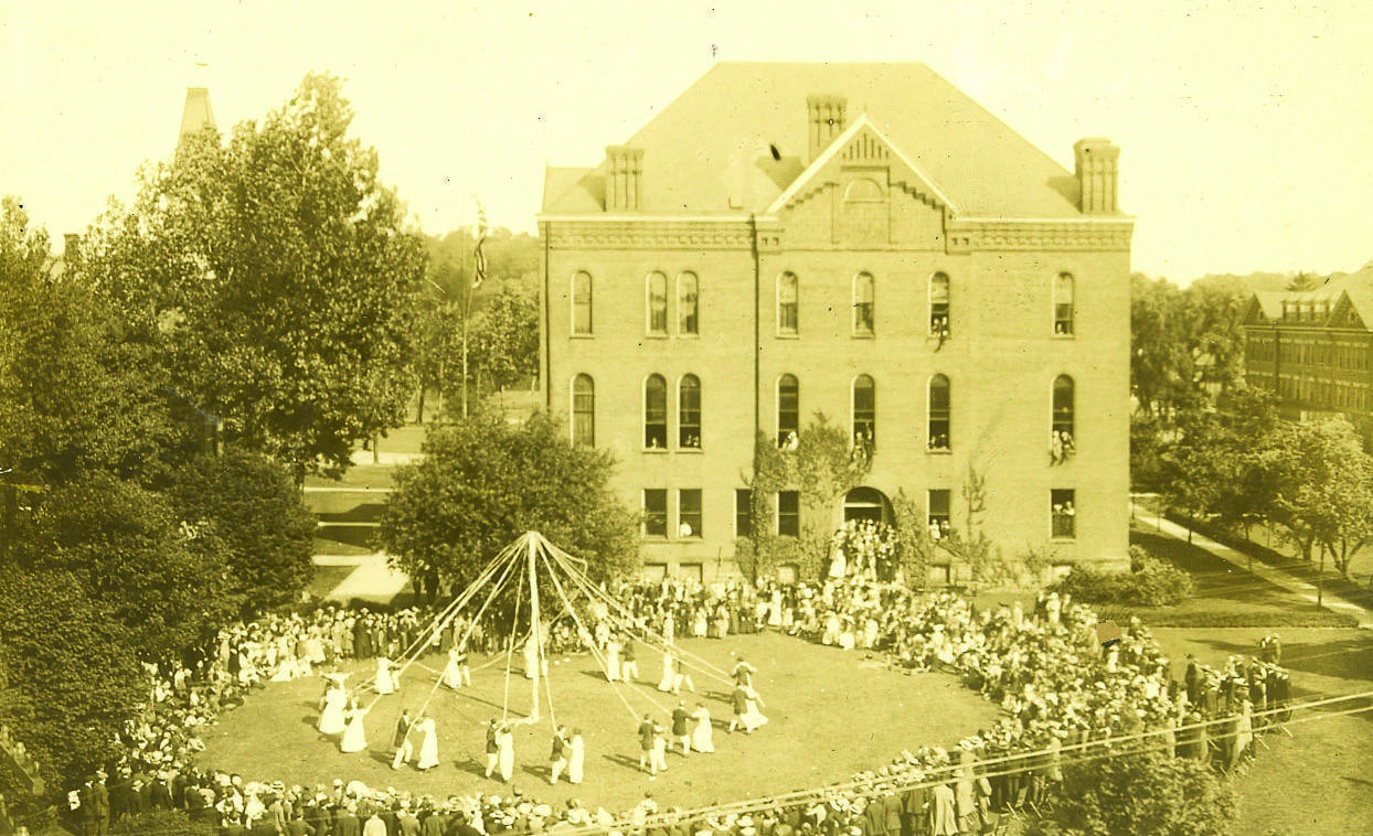 Students dance around a May pole in the early 20th century.